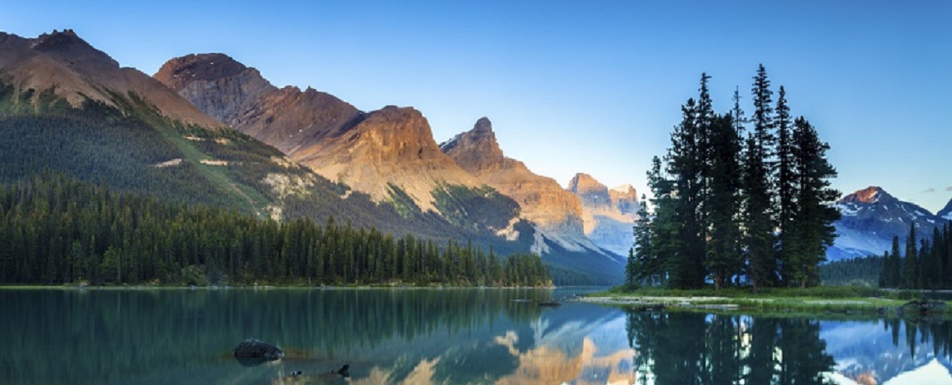 Oh Canada! (Mountain and trees reflecting on a lake with a clear blue sky)
